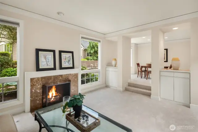 The open floor plan seamlessly connects the main level living and dining spaces to a well appointed kitchen with breakfast nook and family room.