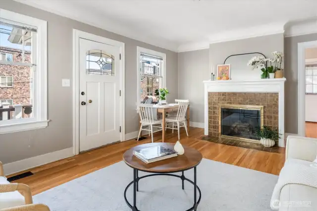 You’ll appreciate the refinished oak floors, and stunning tiled fireplace with convenient gas logs insert.