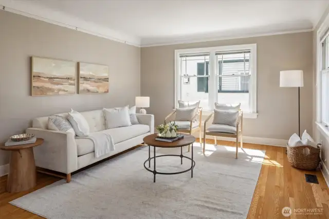 The coved ceilings, original picture rails and handsome windows create a wonderful vibe in the Living Room.