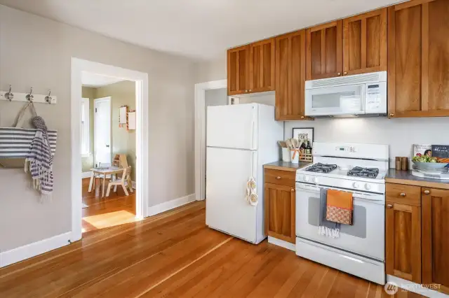 The kitchen with Fir Floors and handsome real wood cabinets is a chef’s dream.