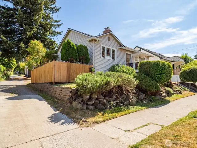 The home sits up off the street with established landscaping in a low-maintenance garden.