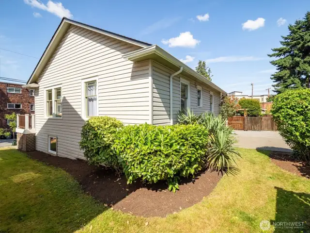 On the back side of the home you can see another glance at the parking pad off the alley.