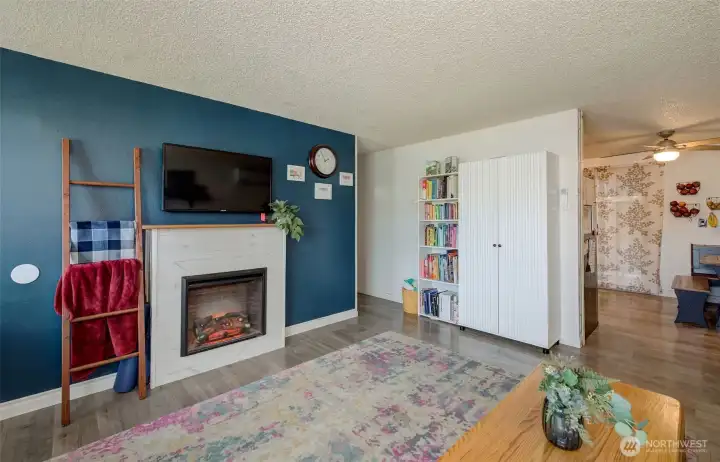 Newer electric fireplace and laminate flooring through out common areas.