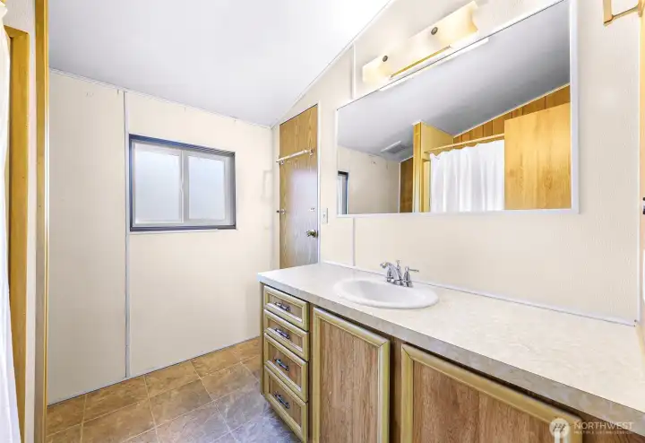 Full Bathroom with access to Primary Bedroom