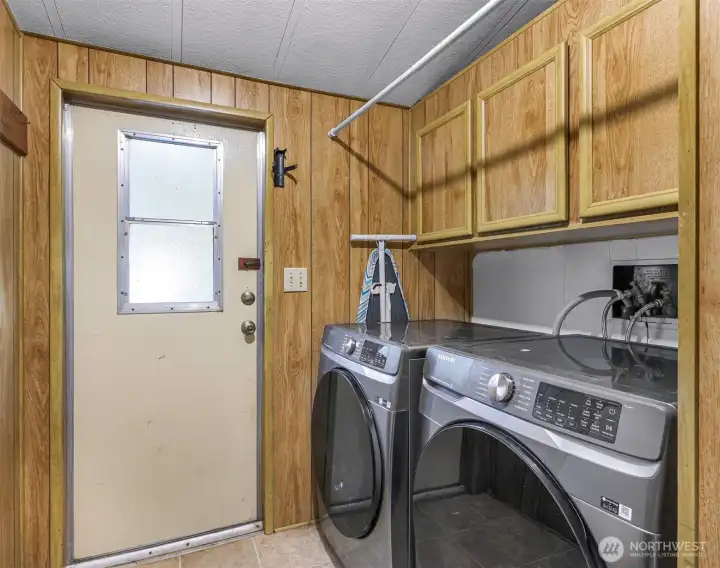 Large Utility Room with outdoor access to newer back deck