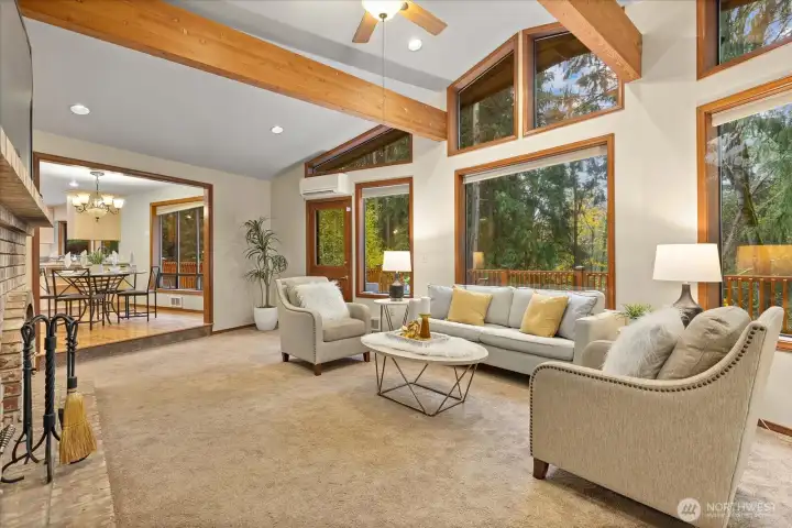 A window wall floods lots of natural light into your living room and the scenic backdrop of  the PNW offers an abundance of privacy.