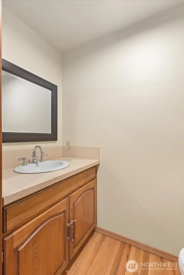 Right off your laundry room is a half guest bathroom.
