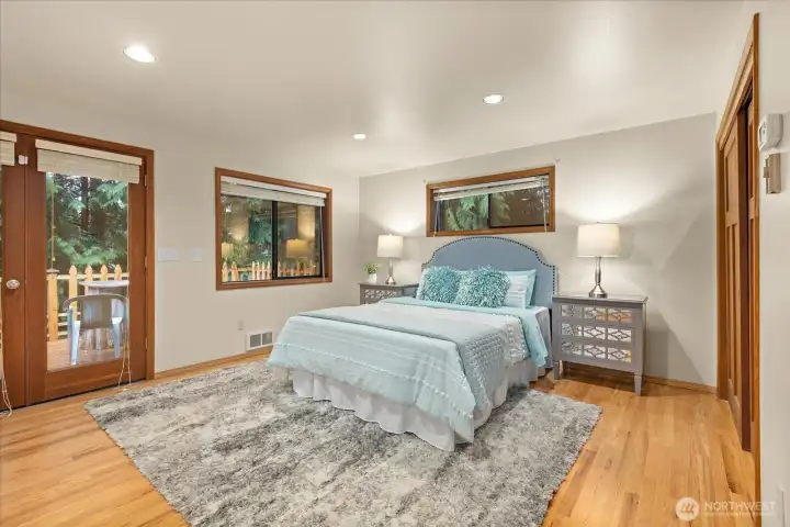 French doors lead into your primary suite which features 2 closets including a walk-in closet, a 5 piece ensuite & access to your deck to enjoy morning coffees or late night wine downs.