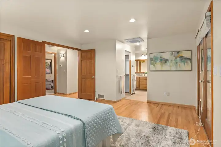 Add a stylish barn door for added privacy between the primary suite and ensuite bath