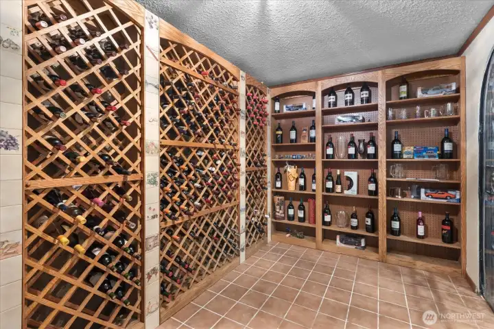 A wine room with plenty of space to set up seating to create your private tasting room. Protect your vintage bottles in your wine cellar.