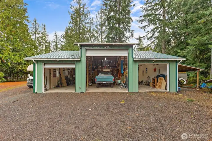 6 car garage with carport! A mechanic's dream with high bay door, power, heat & plumbed for an air compressor! RV parking is effortless  with a dump station & a circular driveway. You'll find additional shelter with the carport.