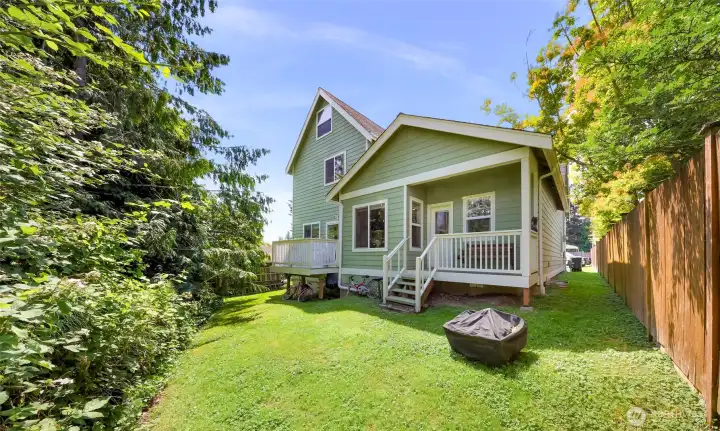A quiet, private backyard  features two decks.