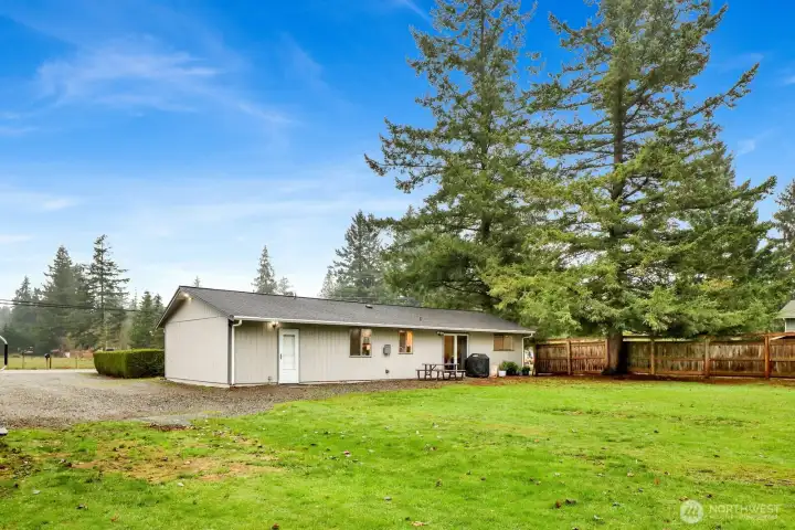 In a quiet but central part of Ferndale, this home has a HUGE flat backyard
