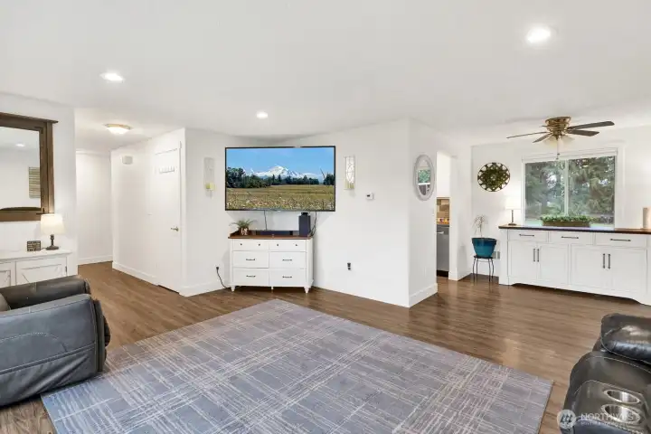 The spacious living room is bright and cheerful.