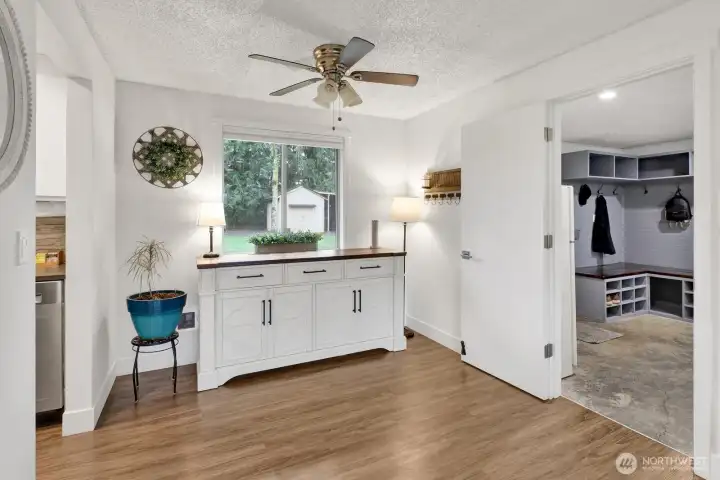 The dining room is open to the living room and leads to the kitchen and bonus room