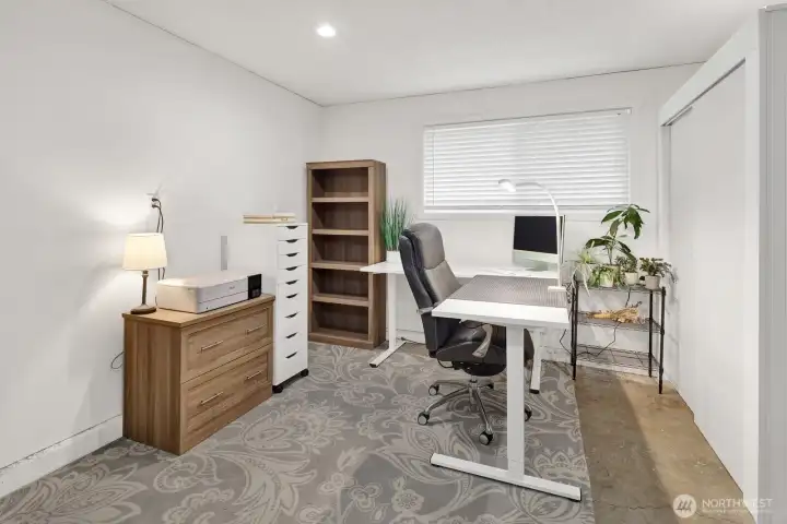 The bonus room is large and is also being used as an office