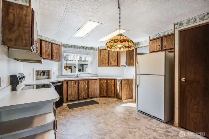 In addition to the many cabinets, there is also a pantry.