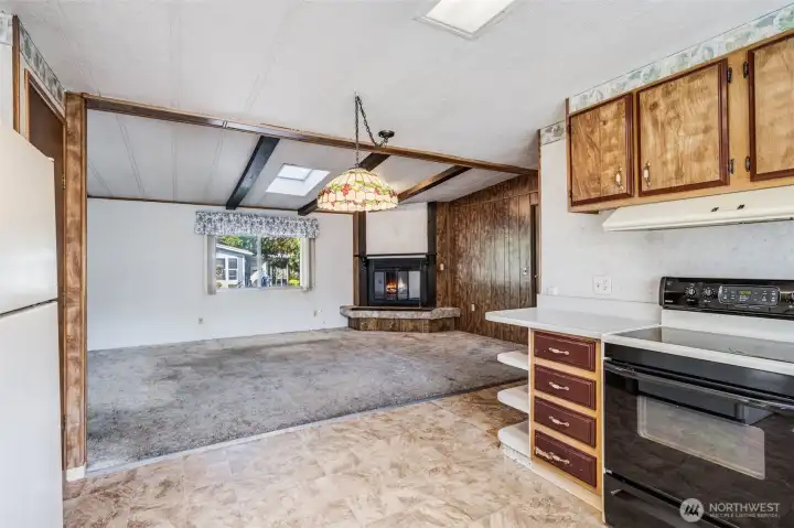 The chef can stay connected and visit with guests gathered in the living room.