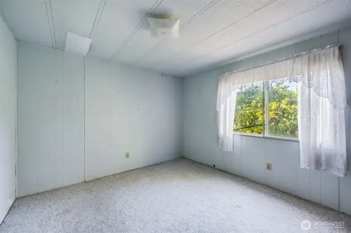 The second bedroom shown without staging.