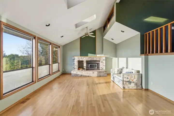 Main Floor Living Room w/ Hardwood Floors, Fireplace, Vaulted Ceiling and Views