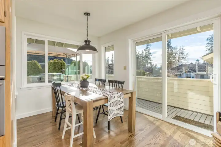 Roomy breakfast nook has slider to the upper deck, perfect for grilling!