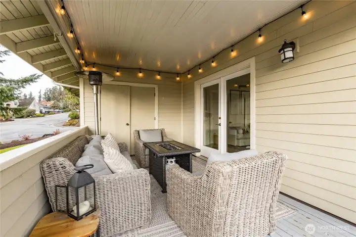 Covered portion of the deck provides year-round use of this outdoor space. Custom shades provide extra sun protection and privacy when needed.