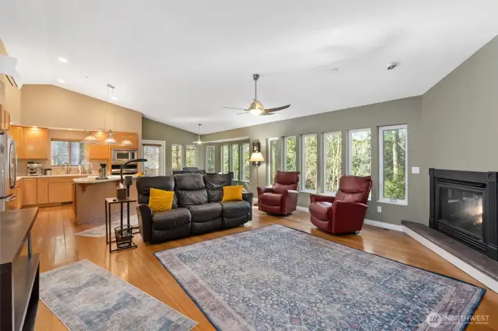 The main residence is anchored by a breathtaking great room with soaring vaulted ceilings, a gas fireplace, & walls of windows overlooking serene Peters Creek.