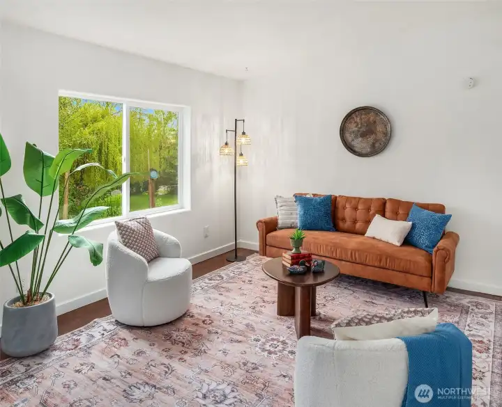 Windows overlook the pond and private yard. This room is freshly painted.