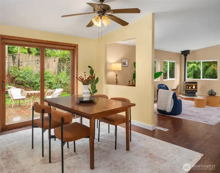 Generous dining area opens onto the paved patio, the kitchen and the family room for easy transitions from food prep to meals to relaxing evenings. Many windows bring in the light. Vaulted ceilings add to the spacious feeling.