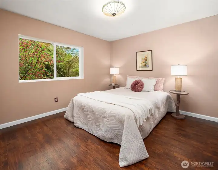 Third bedroom with window overlooking the sweet, private yard.