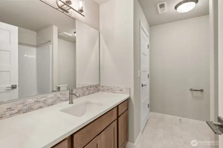 Upstairs main bath with linen closet.