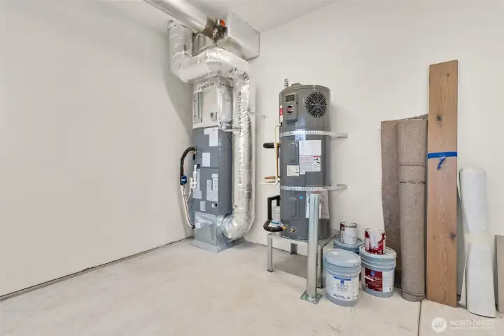 High efficiency Carrier electric forced-air furnace and Electric hybrid water heater.