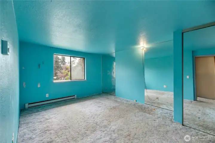 Spacious primary bedroom featuring connected bathroom access for added convenience and comfort Spacious primary bedroom featuring connected bathroom access for added convenience and comfort