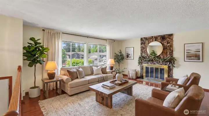 Bright living room with large windows and abundant natural light.