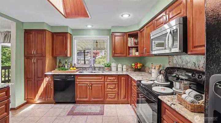 Functional kitchen with ample cabinetry and workspace.