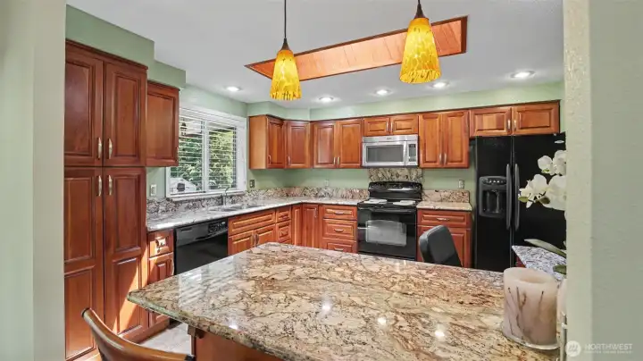 Bright kitchen overlooking the backyard.