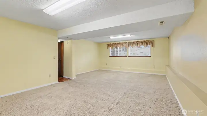 Large rec room perfect for movie nights, gaming, or gatherings.