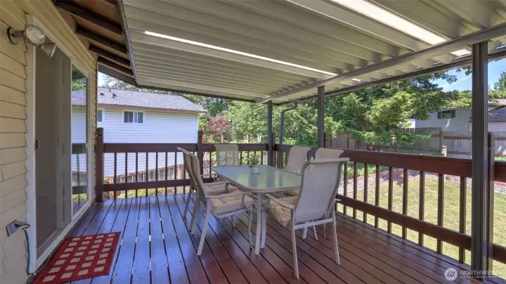 Spacious deck overlooking the backyard.
