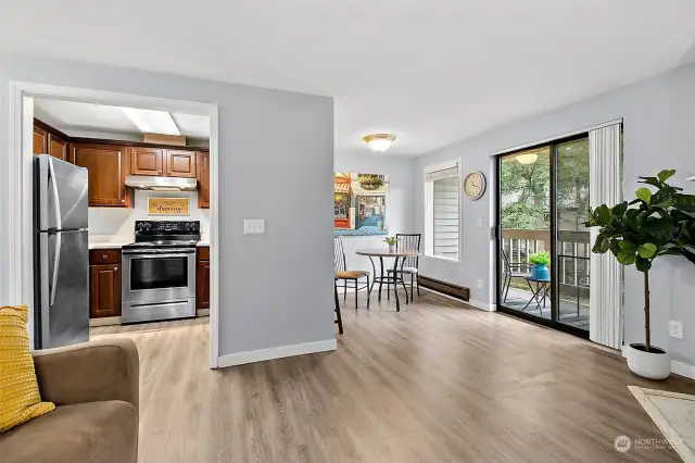 Great view of dining room, kitchen, and private deck.