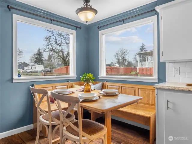 Kitchen table and corner bench stay with the home.