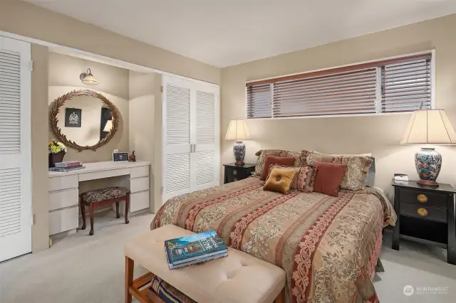 Third main floor bedroom with built in desk, ample closets and access to a full bath.