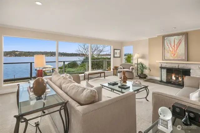 Light filled living room with gas fireplace.