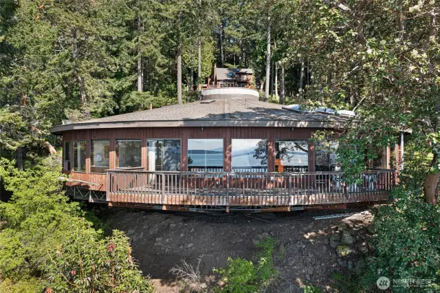 This unique Pedestal home designed by Lory Ice enjoys spectacular water and sunset views.