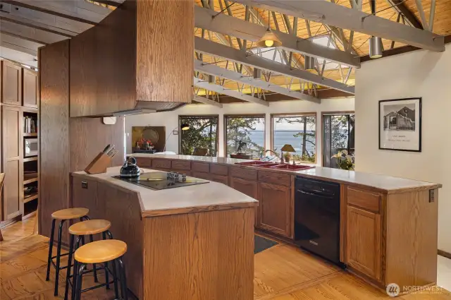 The kitchen with plentiful counter and storage space as as gorgeous views.