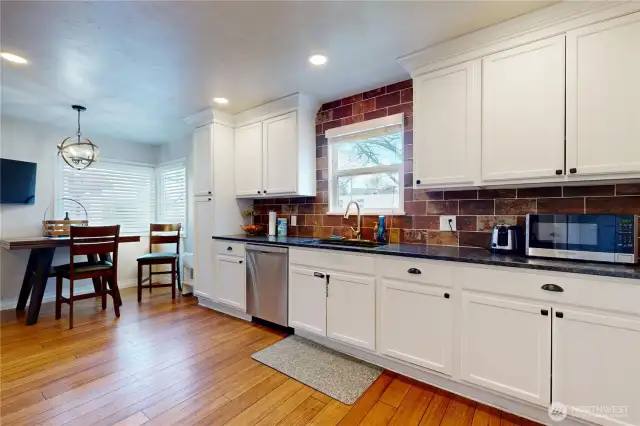 Updated kitchen with granite counters, stainless appliances and eat in kitchen