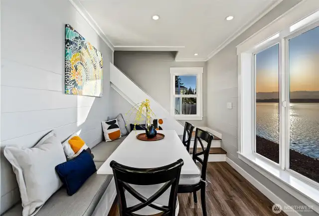 Indoor comfort flows effortlessly outdoors at 7316 Eastside Drive NE. This cozy corner opens to the Soundscape Lounge and cabana—perfect for a morning read, an afternoon nap, or cocktails under the stars. Life at the Beach House blurs the line between inside and out.