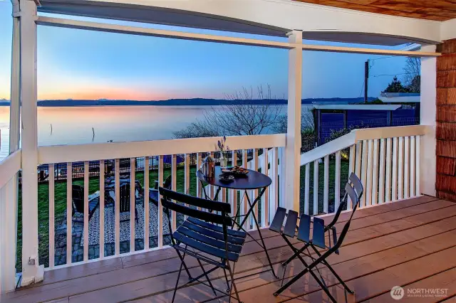 Sunlight and Sound views fill the living room at 7314 Eastside Drive NE. Original hardwood floors, classic millwork, and crisp white walls create a timeless coastal canvas—ready to relax, refresh, or reimagine. A front-row seat to the sea from the comfort of home.