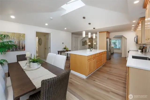 Amazing kitchen is a chef's delight with new quart countertops, newer stainless steel appliances, tons of storage, skylight, designer lighting and generous dining space.