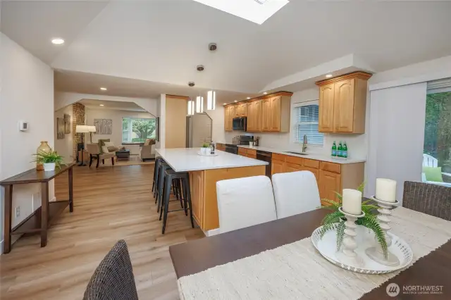 Amazing kitchen is a chef's delight with new quart countertops, newer stainless steel appliances, tons of storage, skylight, designer lighting and generous dining space.