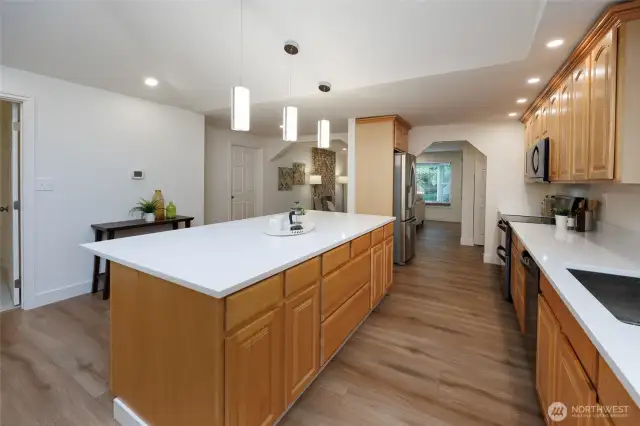 Amazing kitchen is a chef's delight with new quart countertops, newer stainless steel appliances, tons of storage, skylight, designer lighting and generous dining space.